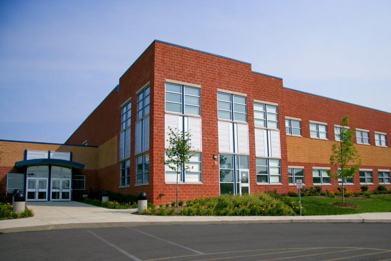 Modern brick building with large windows exterior.